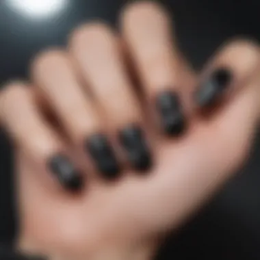 Creative nail art design featuring black heart stickers