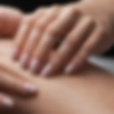 Close-up of a French manicure wrap application technique demonstrating precision