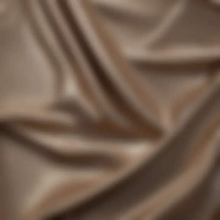 A close-up of the shimmering fabric of a metallic halter mini dress, highlighting its texture and sheen.