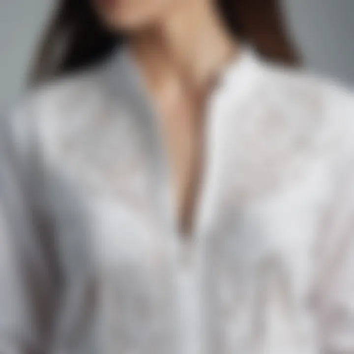 Close-up of intricate design details on a white long top