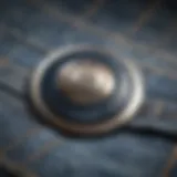 Close-up view of a jeans button extender demonstrating its unique design.